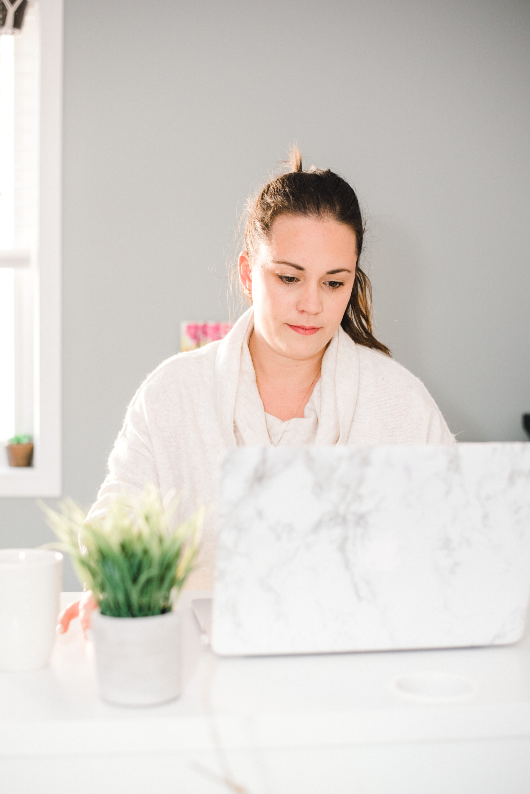 Victoria Cornell working at her laptop